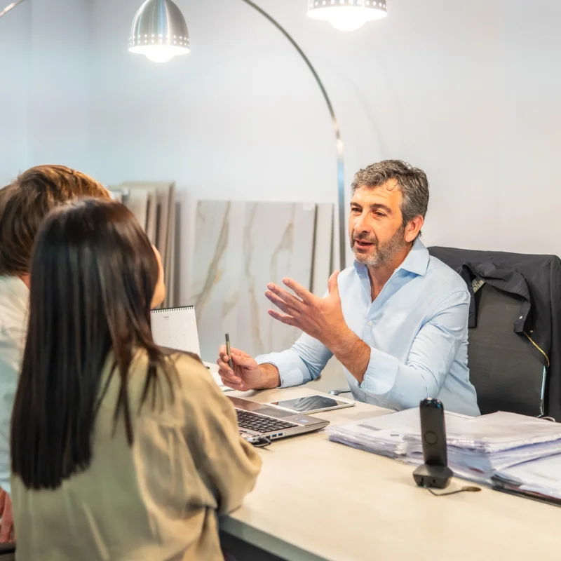 Businessman discussing service pricing with clients